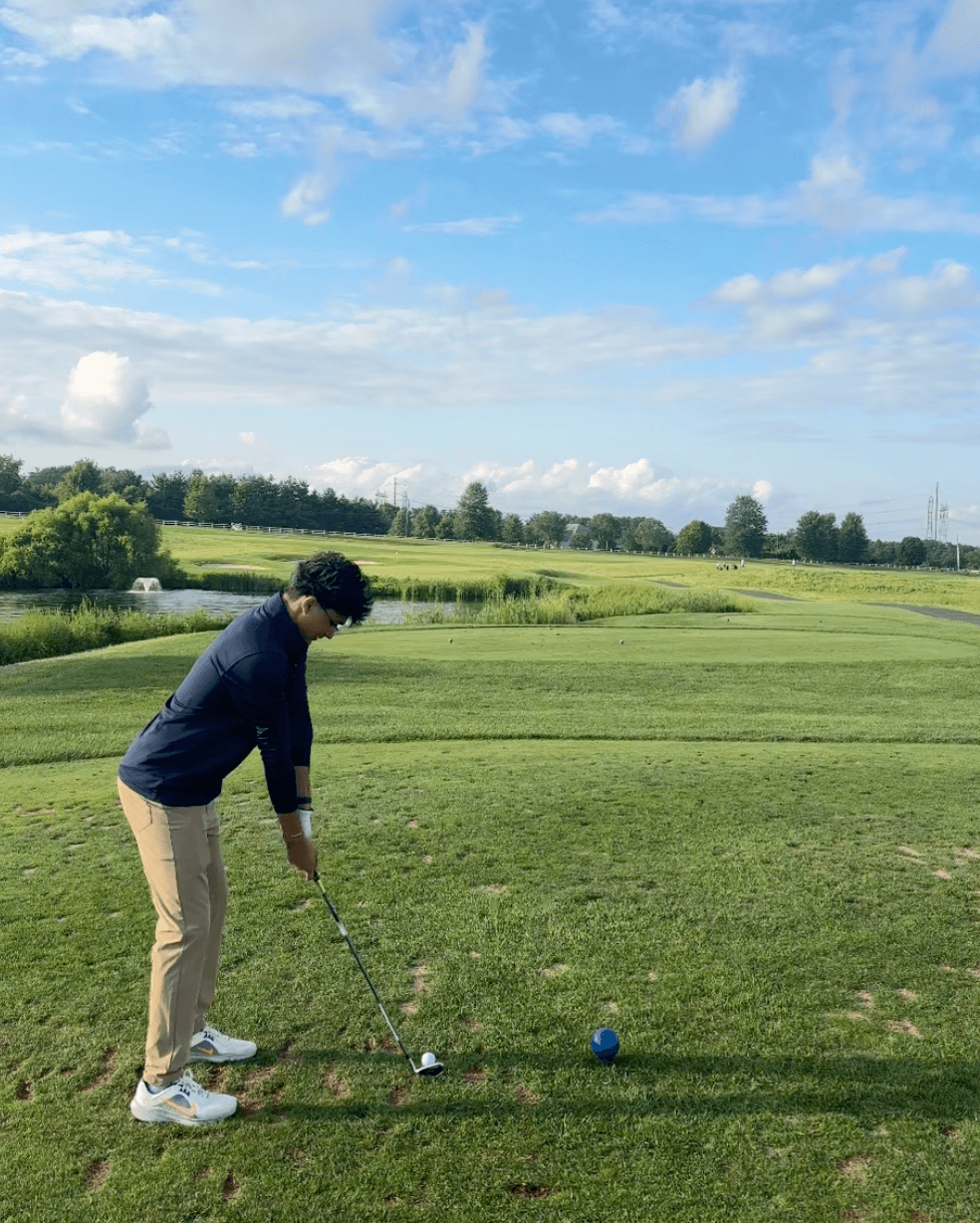Golf shot moment on the course.